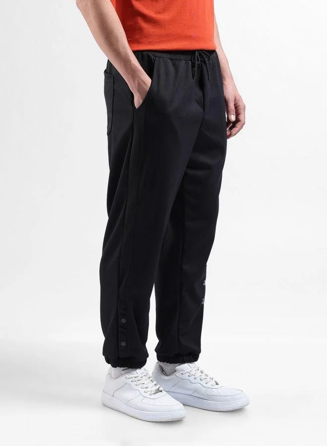 The Indian Garage Co  Men Relaxed Fit Embroidered Side Pocket Mid-Rise Joggers for Men | Best Price UAE